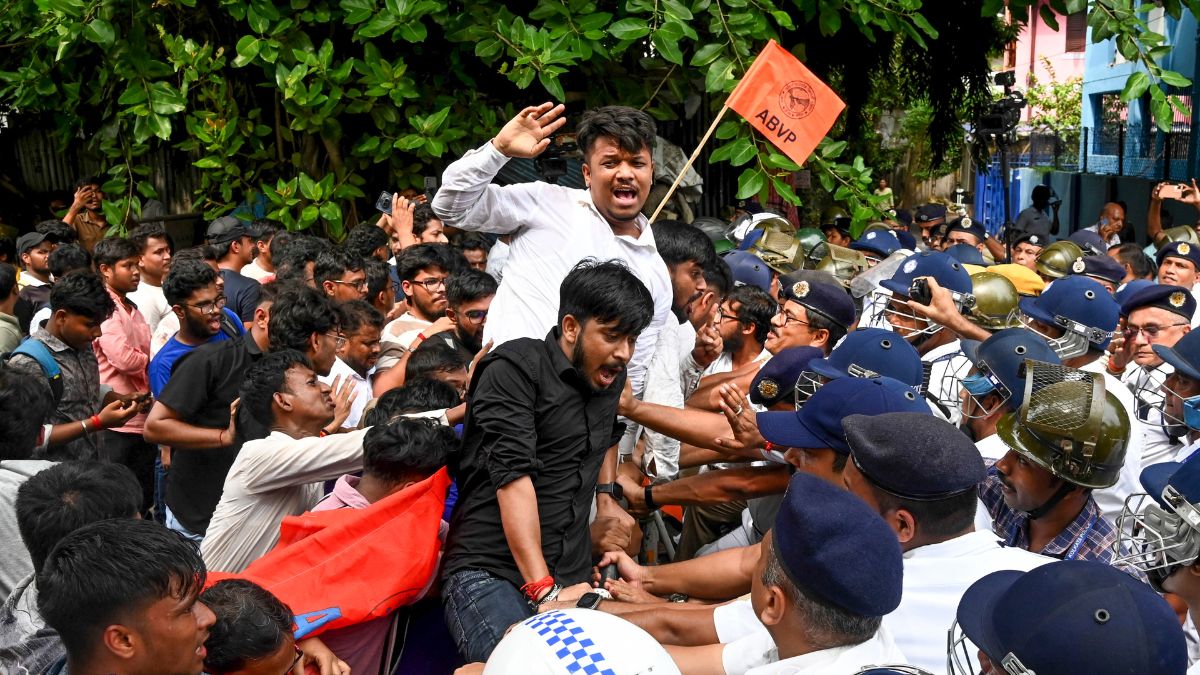 Security personnel stop members of the Akhil Bharatiya Vidyarthi Parishad (ABVP) during their 'Jadavpur University Abhiyan' rally, organized to protest against an alleged attack on their office-bearers inside the university campus the previous night, in Kolkata, on August 20, 2026 | PTI
