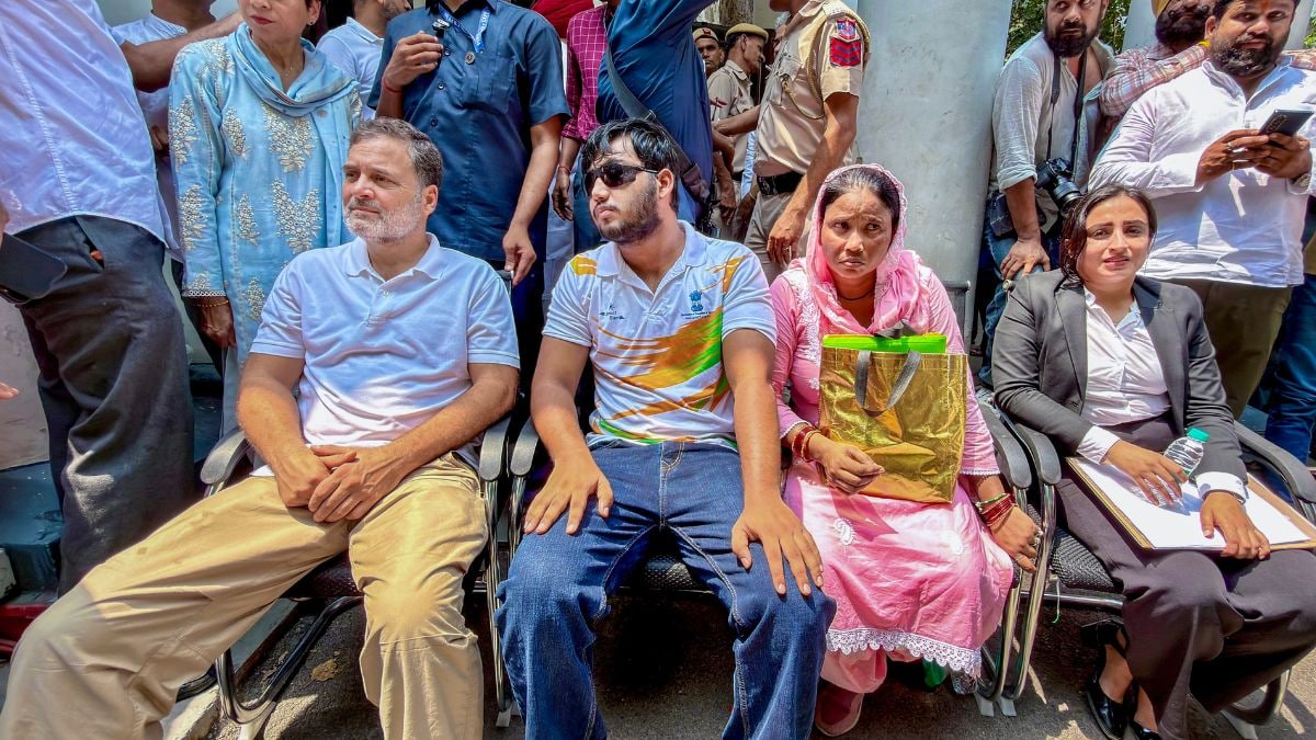 Opposition in the Lok Sabha Rahul Gandhi, left, sits on dharna at Parliament Street police station demanding registration of FIR over pellet injuries during Jul 20 protest, in New Delhi | PTI