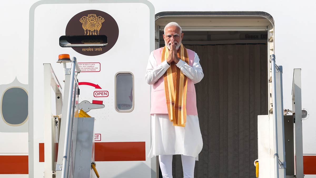 Prime Minister Narendra Modi gestures as he boards the flight for Tashkent | PTI