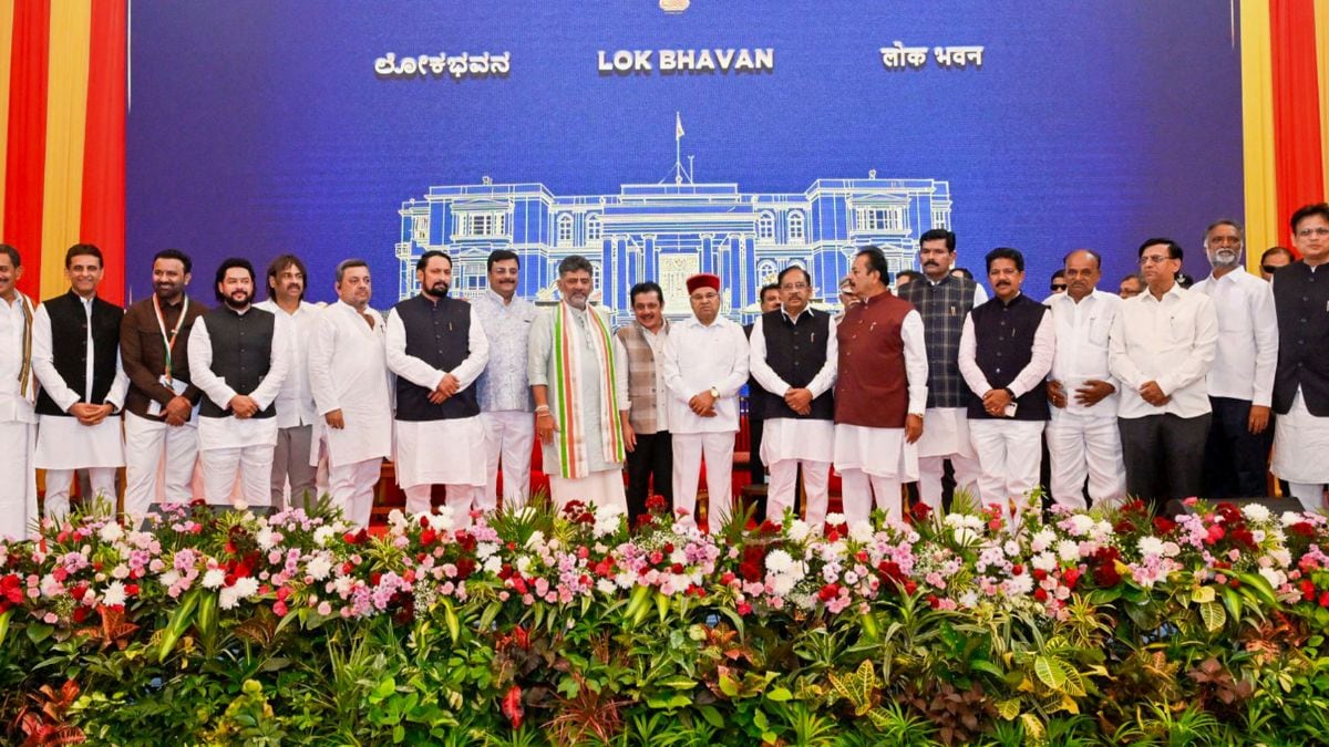 Karnataka Chief Minister DK Shivakumar and Governor Thawar Chand Gehlot pose with newly inducted ministers and other leaders after the swearing-in ceremony following the expansion of the state Cabinet, at Lok Bhavan | PTI 
