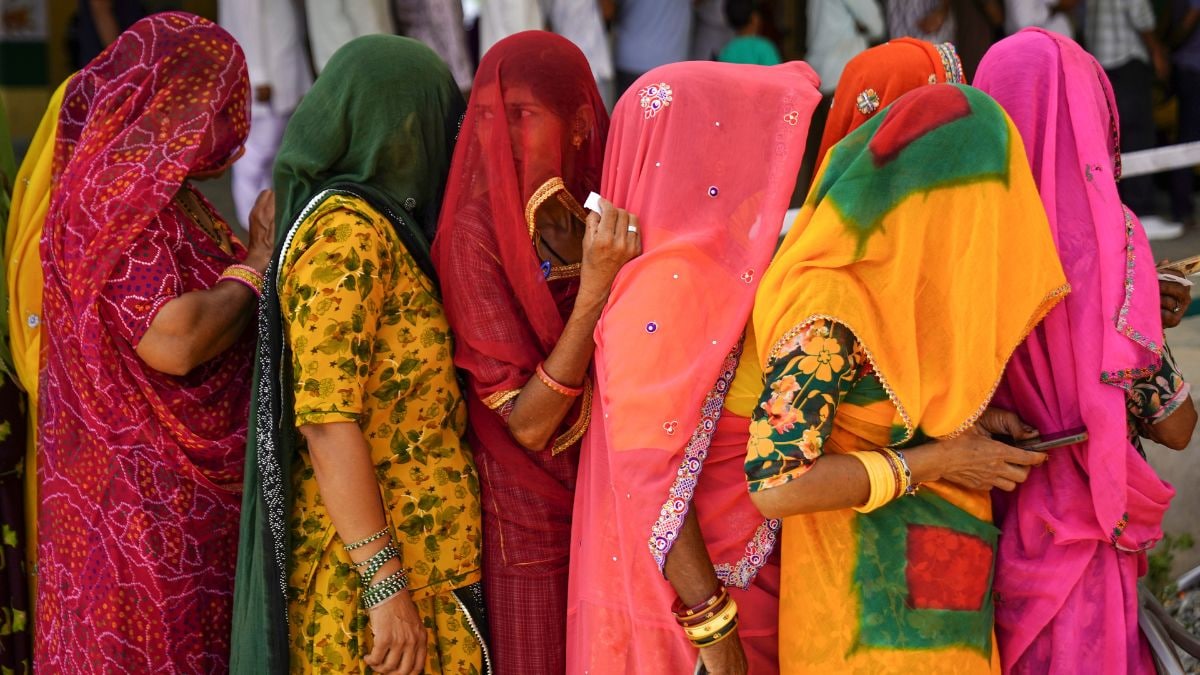 Women wait in a queue to cast votes during the second and final phase of the urban local body elections, at a polling station, in Ajmer district | PTI
