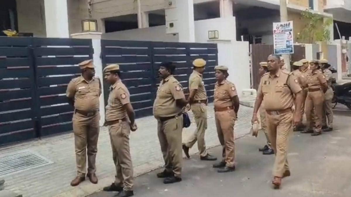 Police officials outside the residence of former Tamil Nadu school education minister Anbil Mahesh Poyyamozhi in Tiruchirappalli | PTI