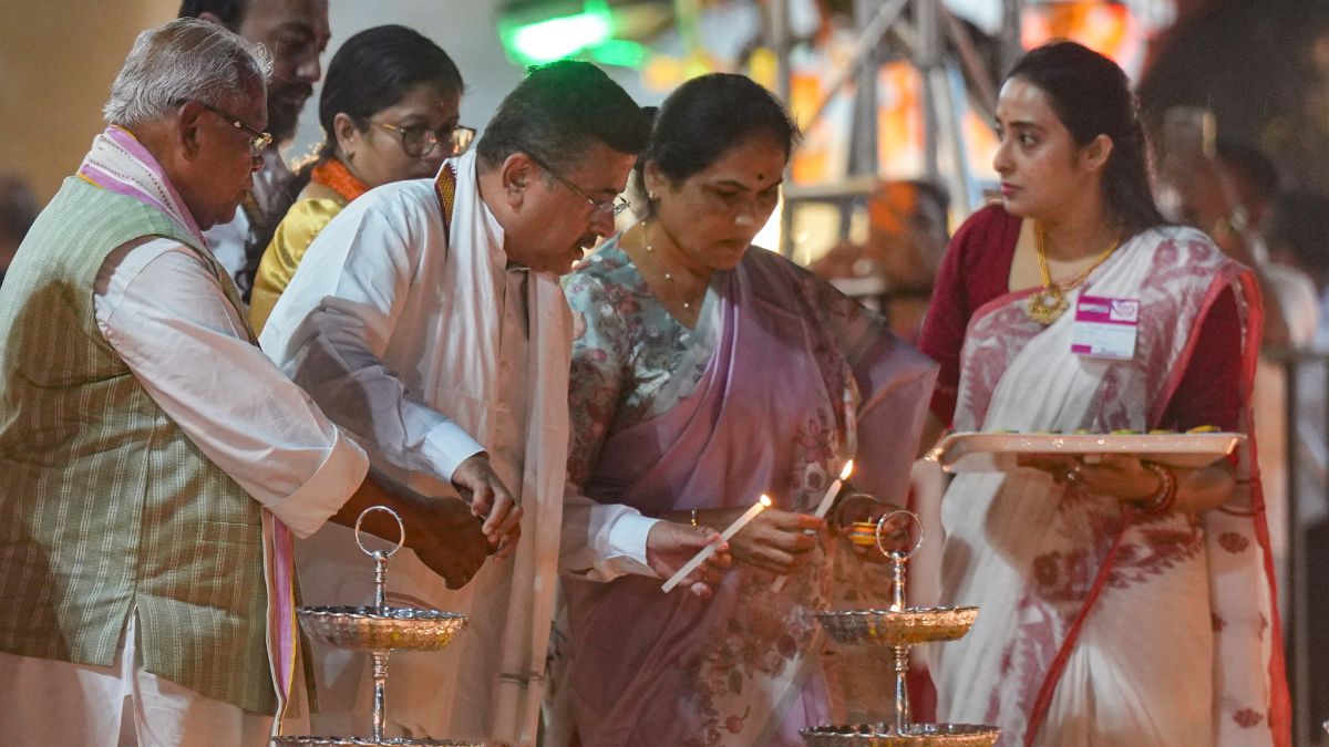 Union Minister Jitan Ram Manjhi, West Bengal Chief Minister Suvendu Adhikari, Union Minister of State Shobha Karandlaje and others light 'diyas', earthen lamps, during an event marking Prime Minister Narendra Modi's birthday, at Baje Kadamtala Ghat, in Kolkata | PTI