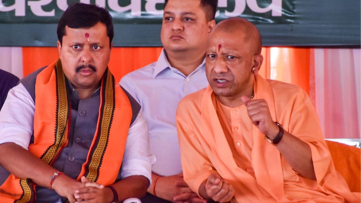 Uttar Pradesh Chief Minister Yogi Adityanath in a conversation with BJP National President Nitin Nabin during the Shakti Kendra Convenor Conference (Western Region), in Meerut | PTI