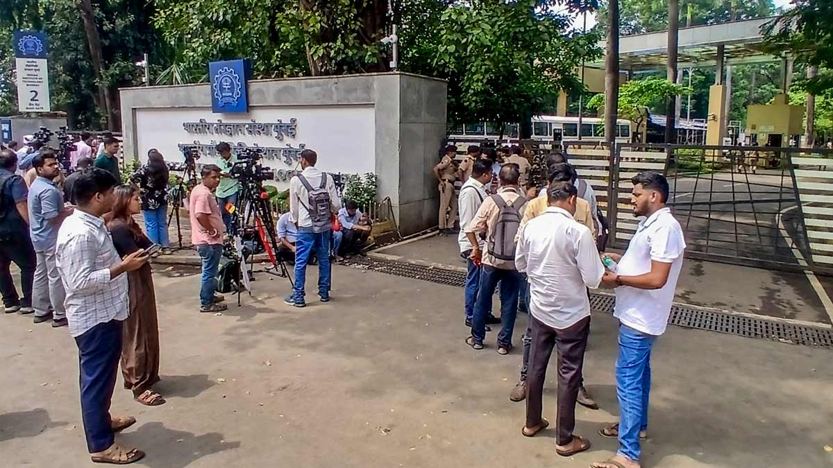 Media personnel wait outside IIT Bombay campus as police officials stand guard the area following the recent death by suicide of a 22-year-old second-year B Tech student | PTI