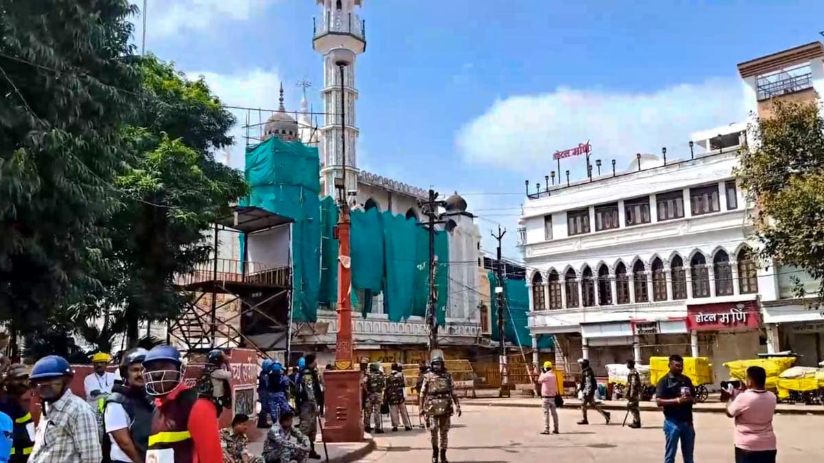 Security personnel keep vigil following stone-pelting incidents during protests against the proposed removal of a portion of the 'Shahi Masjid' for road widening, in Ujjain | PTI