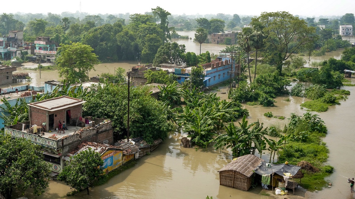 An aerial view shows houses partially submerged in floodwaters after a rise in the water level of the Ganga river, in Vaishali district of Bihar | PTI