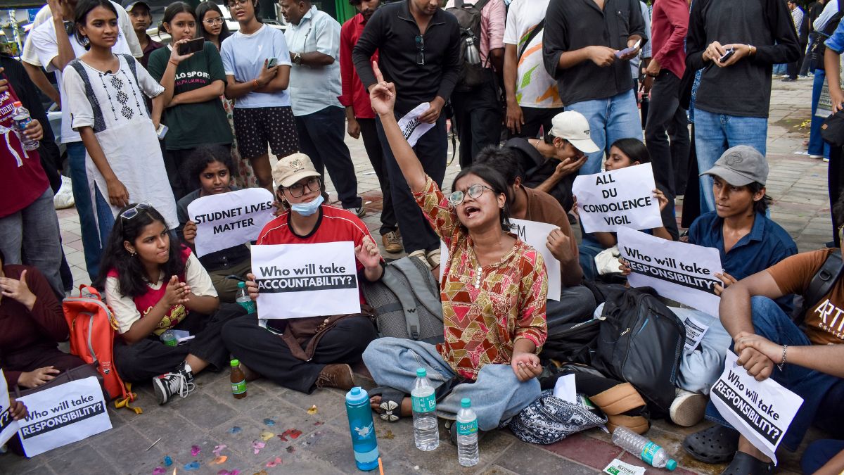 Students stage a protest demanding safety audits of PGs and university-regulated hostel accommodations outside Durgabai Deshmukh South Campus metro station, a day after a five-storey building housing a boys' hostel collapsed in Satya Niketan, in New Delhi | PTI