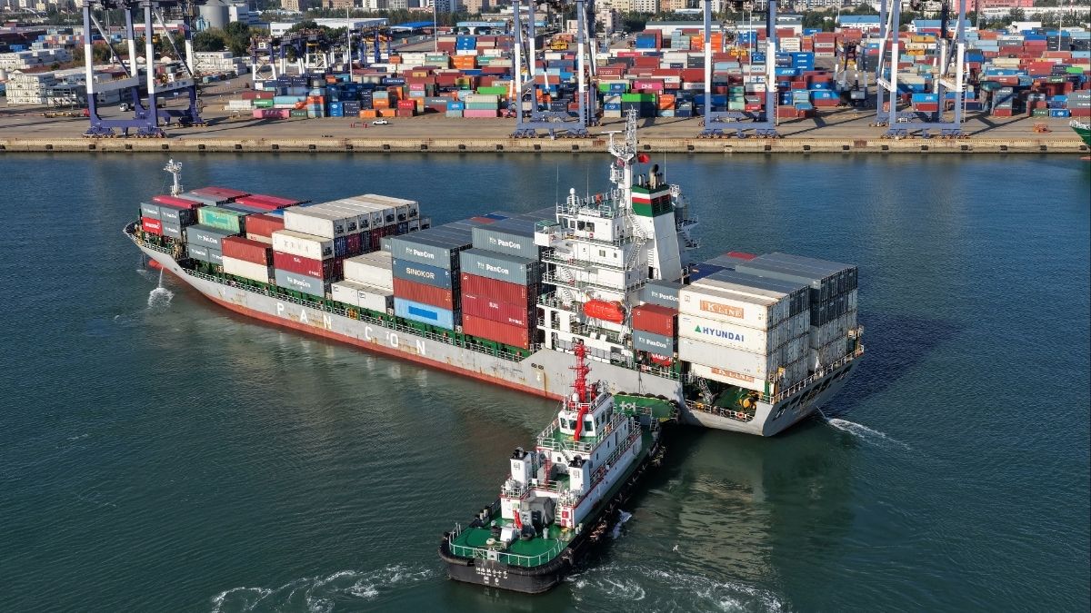 Representative image: A tugboat pushes a container ship to a port in Yantai | AP