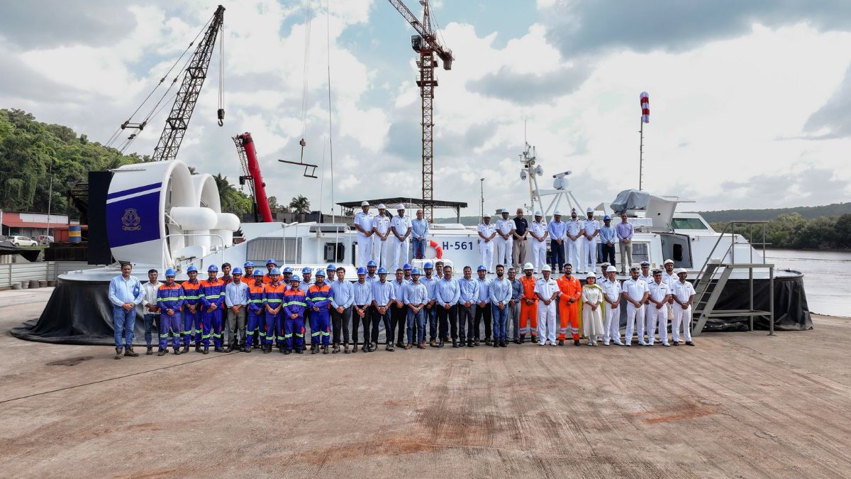 Personnel from the Indian Coast Guard and the Chowgule Shipyard stand beside the newly inducted Air Cushion Vehicle (ACV) | X/@IndiaCoastGuard
