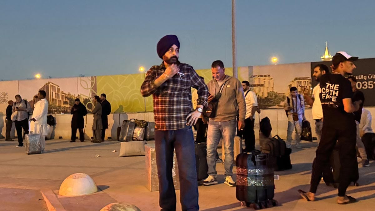 People gather outside a metro station on the road to King Khalid International Airport in Riyadh | AP