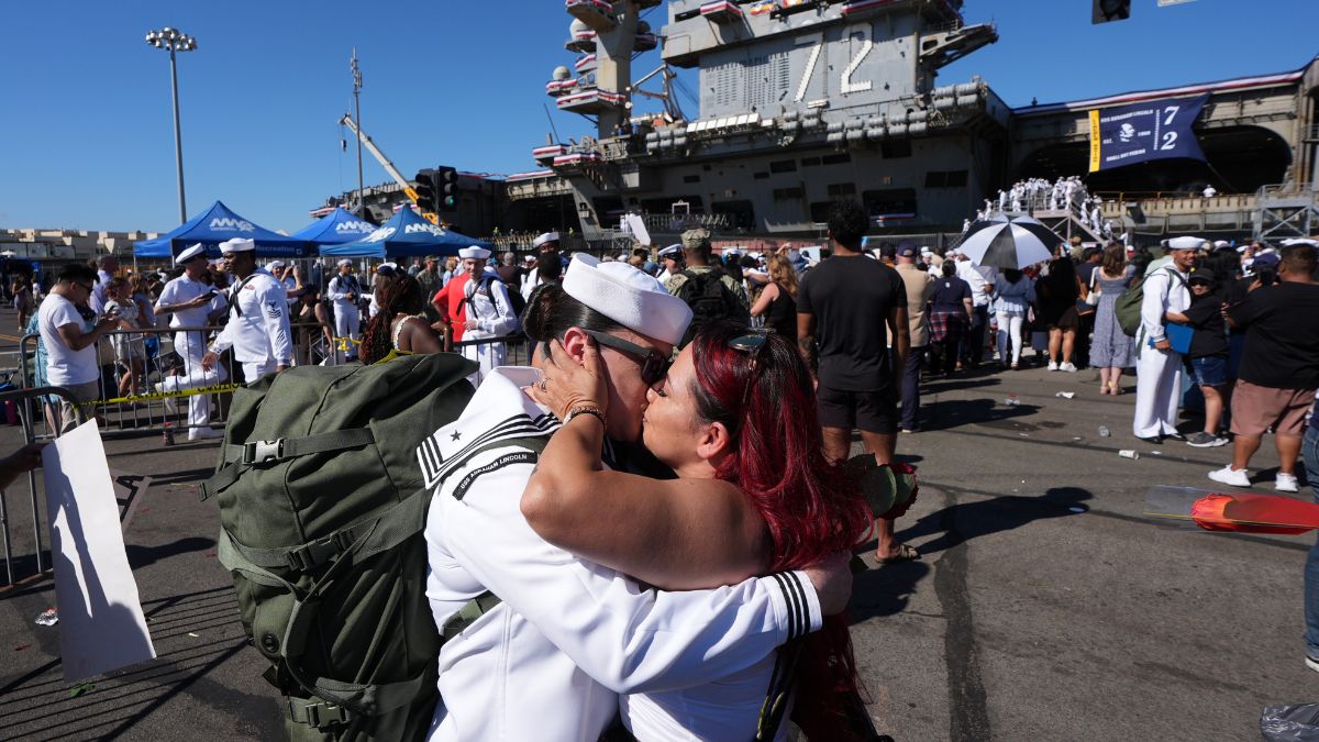 Sailor Maria Villa, left, kisses her wife, Lucy Villas after the USS Abraham Lincoln aircraft carrier returned to Naval Air Station North Island after deployment Thursday | AP 