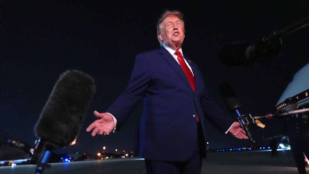 US President Donald Trump talks to reporters after arriving on Air Force One | AP