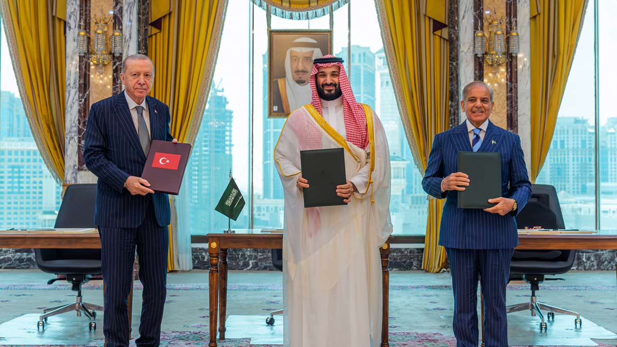 From left, Turkish President Recep Tayyip Erdogan, Saudi Crown Prince Mohammed bin Salman and Pakistani Prime Minister Shehbaz Sharif pose after signing a trilateral defense agreement in Mecca | AP