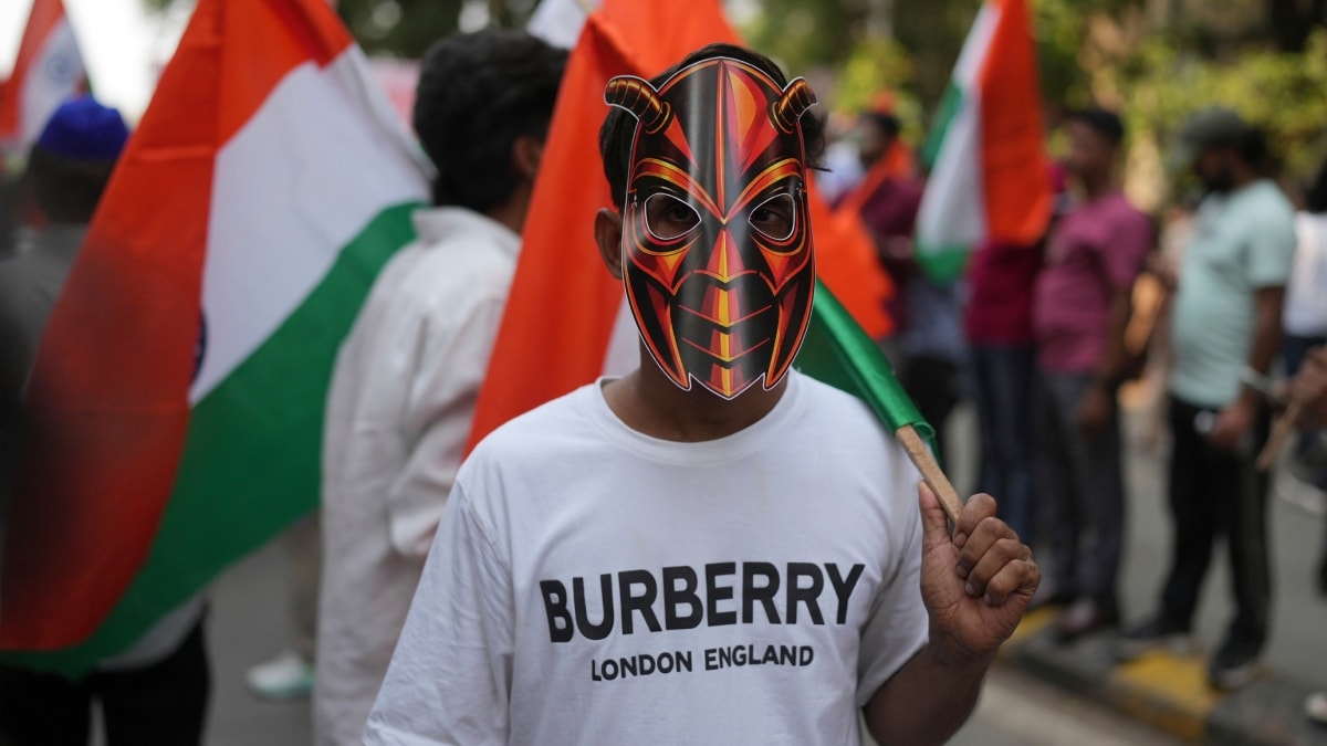 A supporter of the Cockroach Janta Party wears a mask as he takes part in a protest against Chief Election Commissioner Gyanesh Kumar and call for the suspension of the Special Intensive Revision (SIR) of electoral rolls in Mumbai | PTI