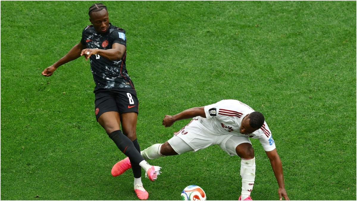 Qatar's Assim Madibo fouls Canada's Ismael Kone | Reuters