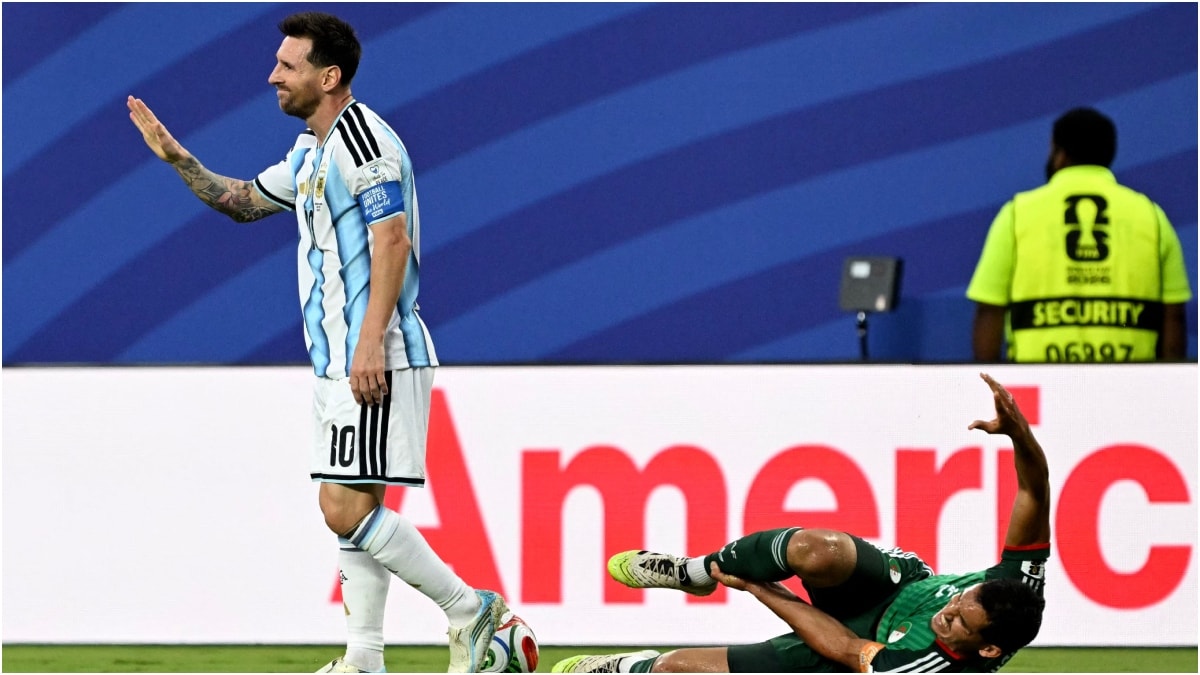 Argentina's Lionel Messi gestures after a foul on Algeria's defender Aissa Mandi during the 2026 World Cup Group J football match | AFP