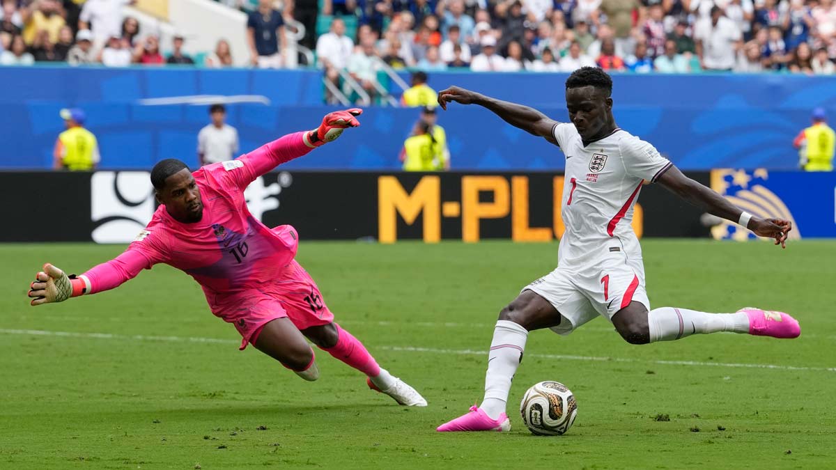 England's Bukayo Saka (7) shoots past France goalkeeper Mike Maignan (16) during the World Cup third-place playoff soccer match | AP