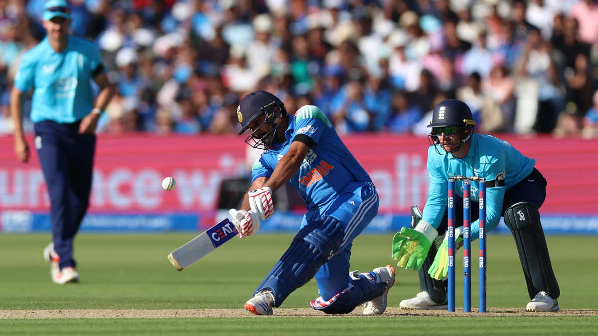 Rohit Sharma hits a four to reach his century in the third ODI between England and India, at Lord's | AP