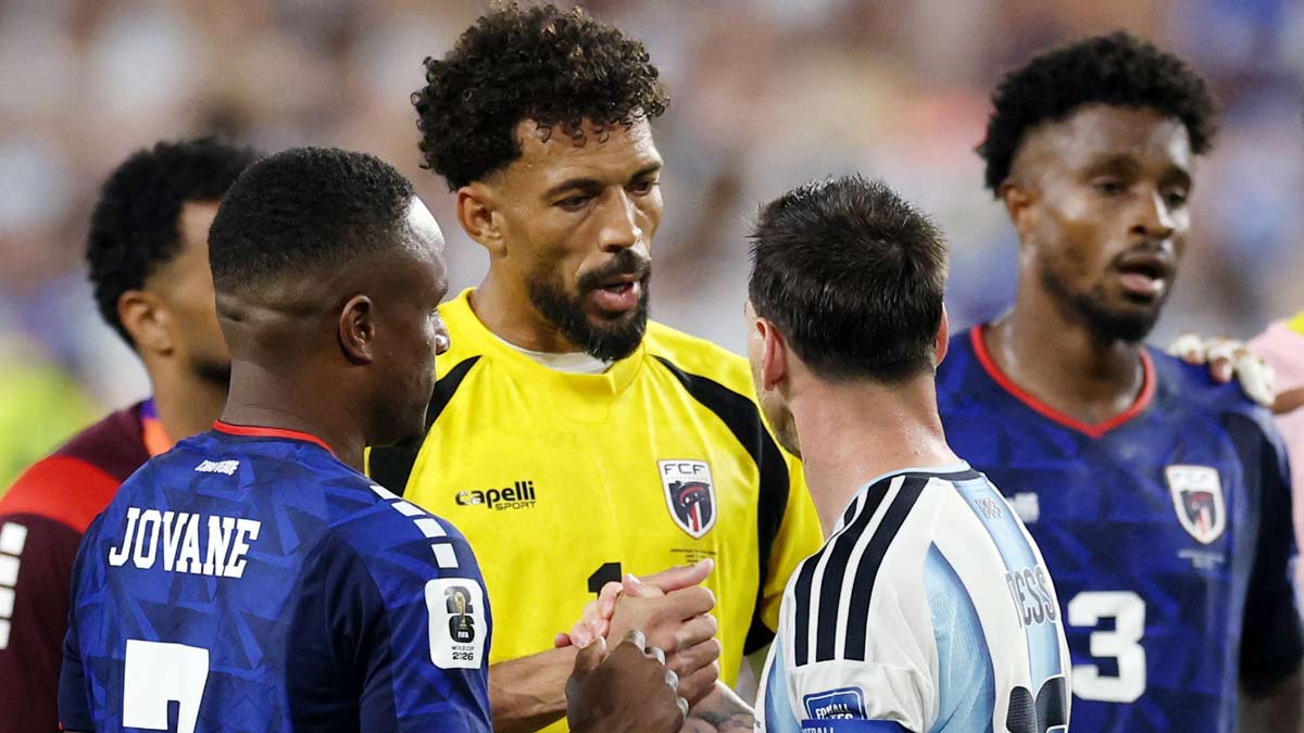 Cape Verde's Vozinha shakes hands with Argentina's Lionel Messi after the match as Cape Verde are eliminated and Argentina qualify for the Round of 16 stage of the World Cup | Reuters