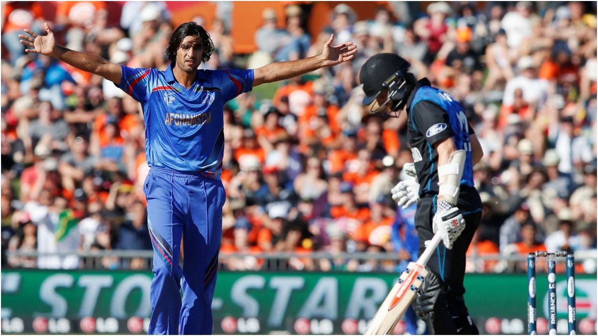 Afghanistan's Shapoor Zadran (L) celebrates dismissing New Zealand's Kane Williamson (R) during their Cricket World Cup match in Napier | Reuters