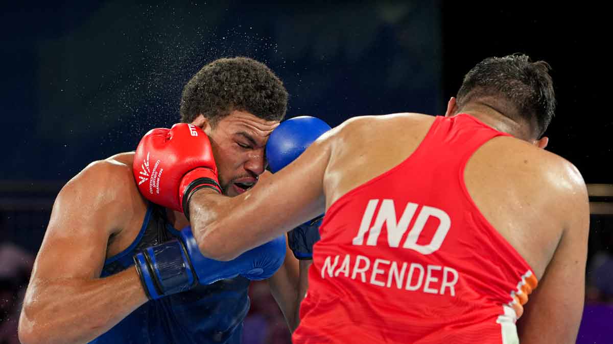 India's Narender, in red, competes against England's Damar Thomas in the men's 90+kg final boxing bout | PTI