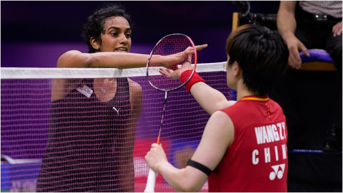 India's PV Sindhu (L) shakes hands with China's Wang Zhiyi after their women's singles round-of-16 badminton match at the BWF World Championships | PTI