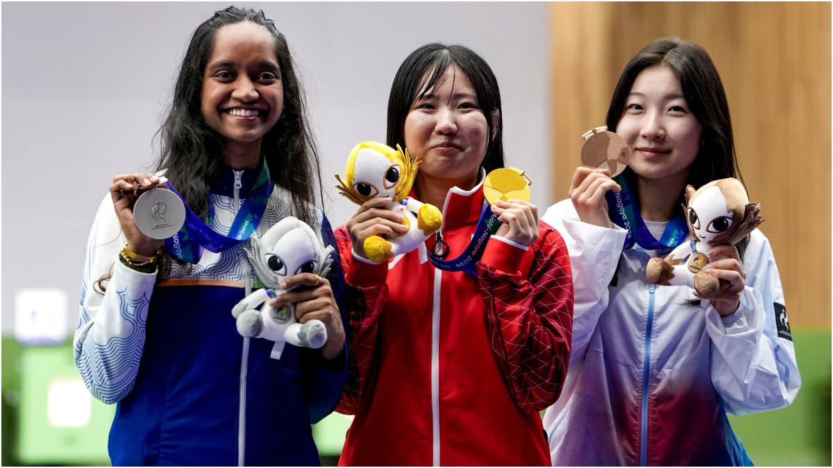 Japan's Taichi H (C), Indias Elavenil Valarivan (L)and South Korea's Ban H with their medals after the women's 10m air rifle event | PTI