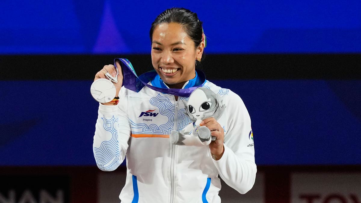 Silver medallist Mirabai Chanu poses on the podium after the women's 49kg weightlifting final at the Asian Games in Nagoya, Japan | AP