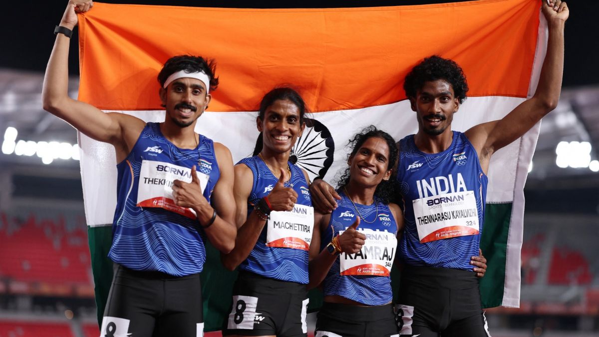 Silver medallists India's Poovamma Raju Machettira, Vishal Thennarasu, Vithya Ramraj and Manu Thekkinalil celebrate after the 4 x 400m Mixed Relay Final REUTERS/Chalinee Thirasupa