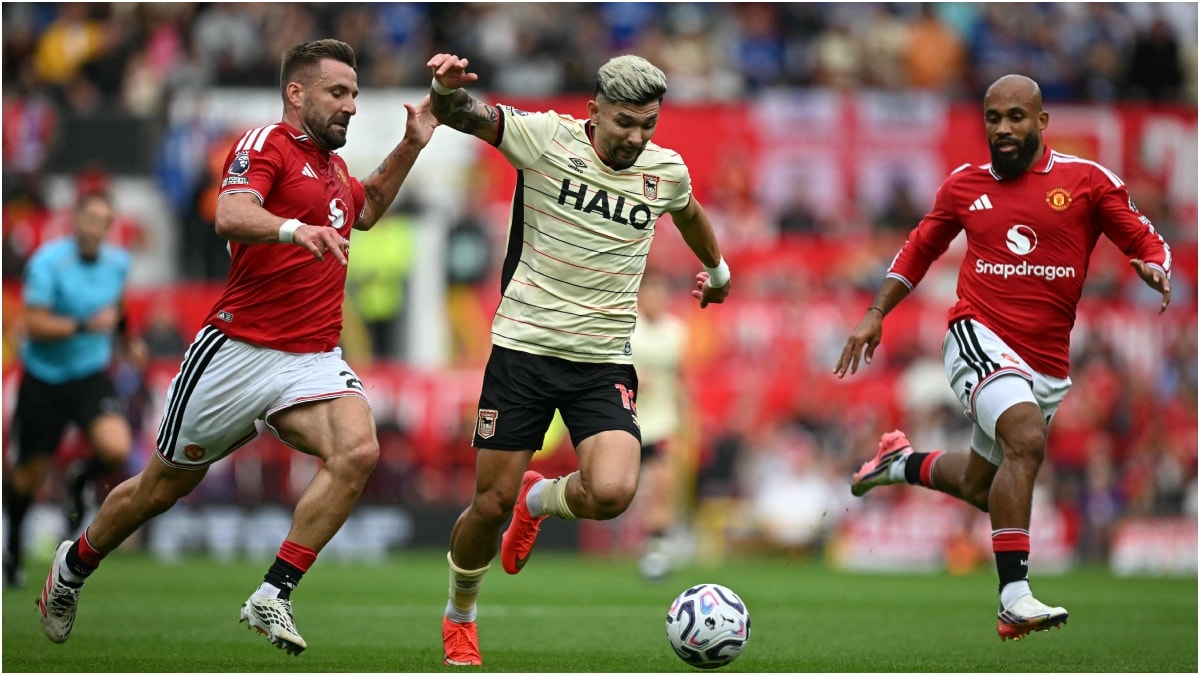 Manchester United defender Luke Shaw (L) and midfielder Bryan Mbeumo (R) challenge Ipswich Town's Paraguayan midfielder Julio Enciso during the English Premier League football match | AFP 