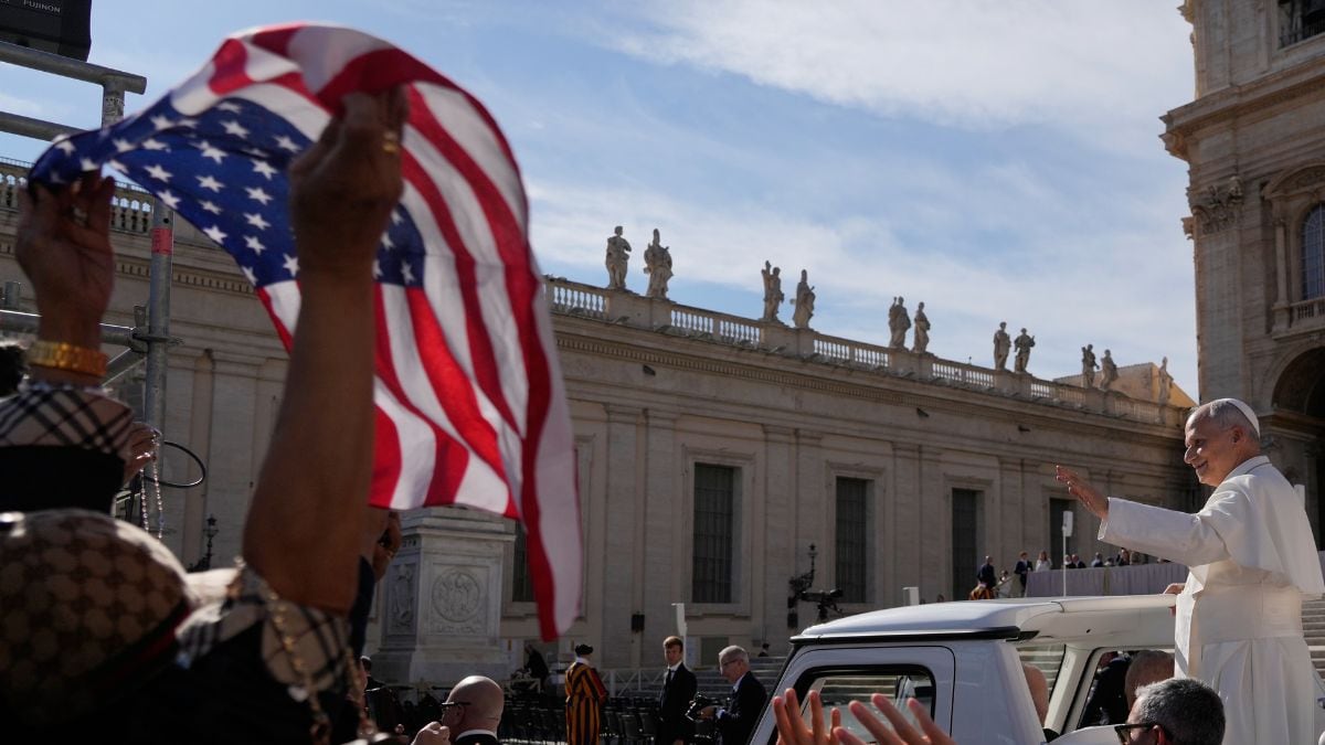 A faithful waving a US flag cheers Pope Leo XIV as he leaves after his weekly general audience in St. Peter's Square at The Vatican, Wednesday, Oct. 28, 2026 | AP