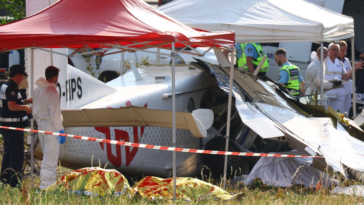Forensic technicians examine a skydiving plane that crashed in Tomblaine, northeastern France, killing all 11 people on board on June 28, 2026 | AP