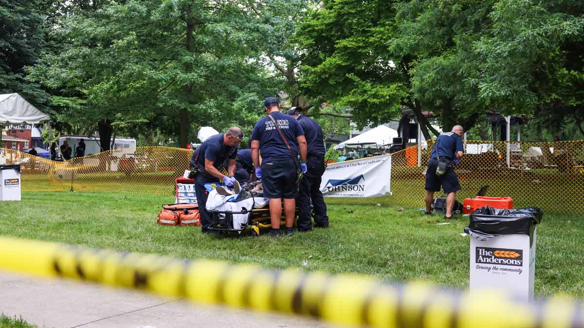First responders help a woman who was injured the mass shooting at the Agnes Reynolds Jackson Arboretum in Toledo, Ohio | AP