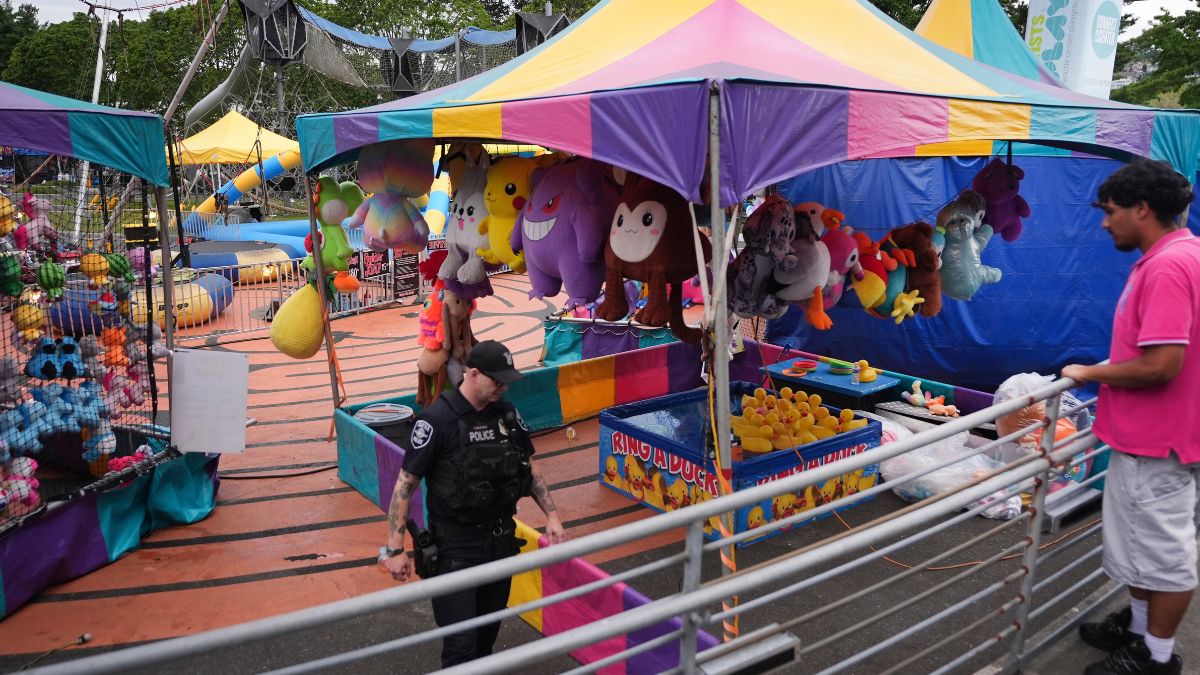A police officer responds after a shooting at Seattle Center during the Bite of Seattle food festival Sunday | AP