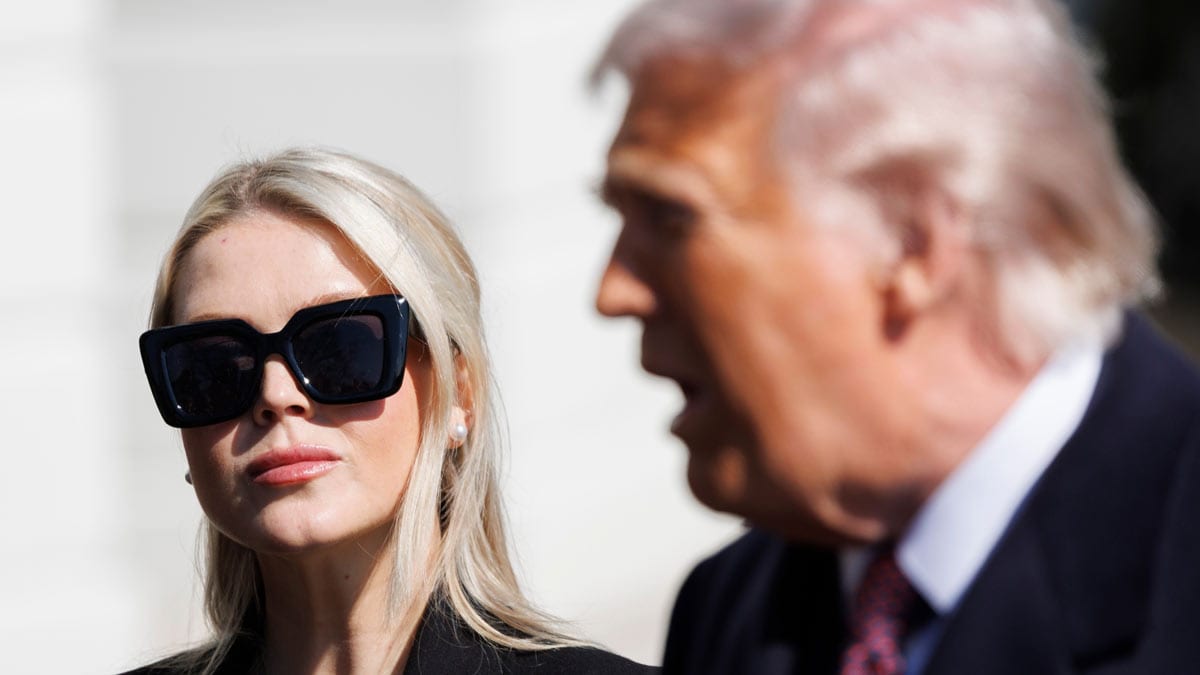 [File] Press Secretary Karoline Leavitt glances at President Donald Trump before departing on Marine One from the South Lawn of the White House, Feb. 27, 2026, in Washington | AP