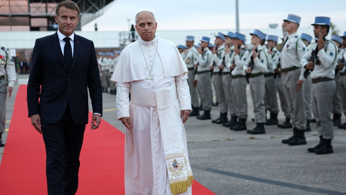 rench President Emmanuel Macron, left, and Pope Leo XIV review troops during a farewell ceremony at the end of the pontiff's apostolic trip, at MetzNancyLorraine Airport in Goin, northeastern France | AP 