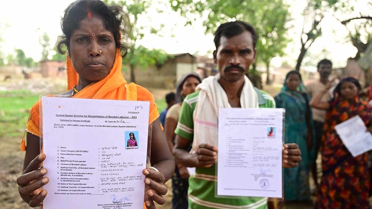 People who worked as bonded labourers at a brick kiln, at Sarvodayapuri, Gaya district, Bihar, with proformas for release certificate | Bhanu Prakash Chandra