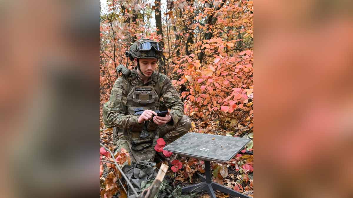 A soldier from an artillery unit in Ukraine sets up Starlink satellite internet system amid Russia's attack on Ukraine | REUTERS