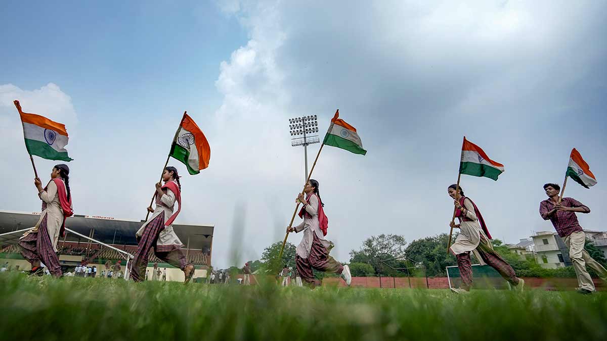 Amritsar: School students hold national flags as they march across the field during a rehearsal for the upcoming Independence Day celebrations at Guru Nanak Stadium, in Amritsar, Punjab, Monday, Aug. 10, 2026 | PTI