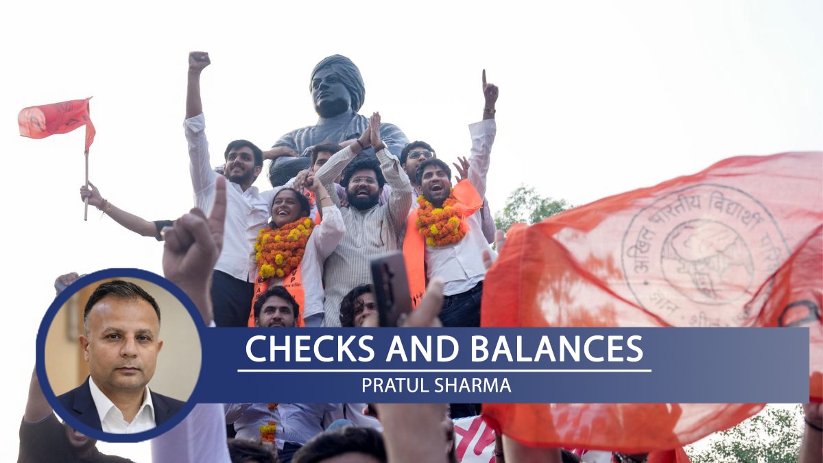 ABVP's Yash Dabas, Riya Chhawdi and Lakshay Raj Singh celebrate with others as they climb atop Swami Vivekanand's statue after winning three of the four central panel posts in the DUSU elections | PTI