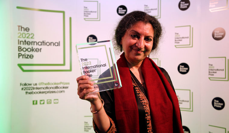 Author Geetanjali Shree poses with the 2022 International Booker Prize award | AP