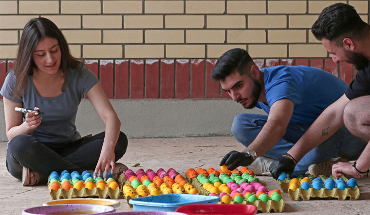 Iraqi Christians decorate Easter eggs in Arbil | AFP