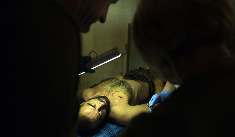 Care in chaos: Medics attending to an injured Ukranian on the frontline | Bhanu Prakash Chandra