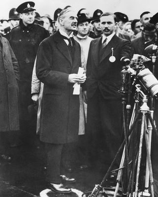 Taking the bait: Neville Chamberlain, prime minister of Britain, reporting there would be "peace in our time", after meeting Hitler at the 1938 Munich Conference | Everett Historical
