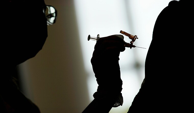 Safety first: A nursing student administers a Covid-19 vaccine in Las Vegas, US | AP