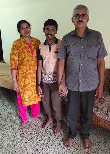 Better every day: Nirmal Krishnan, who has cerebral palsy, has shown great improvement after undergoing VHAB sessions. Here, with his parents.