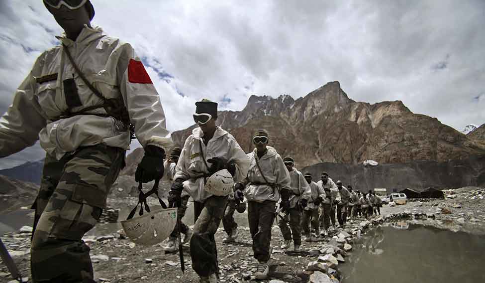 Indian soldiers return after a training session at the Siachen base camp