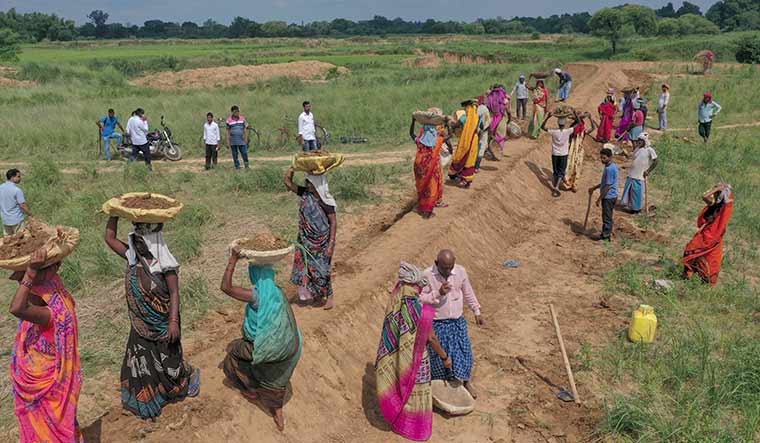Rural gains: NREGA workers in Thekha in Chandauli district in Uttar Pradesh | AP