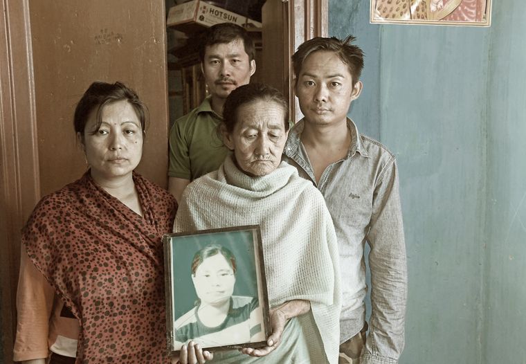 Painful memories: Khumanleima holding Manorama's picture. Flanking her are Manorama's two brothers and sister, Sunita | Salil Bera